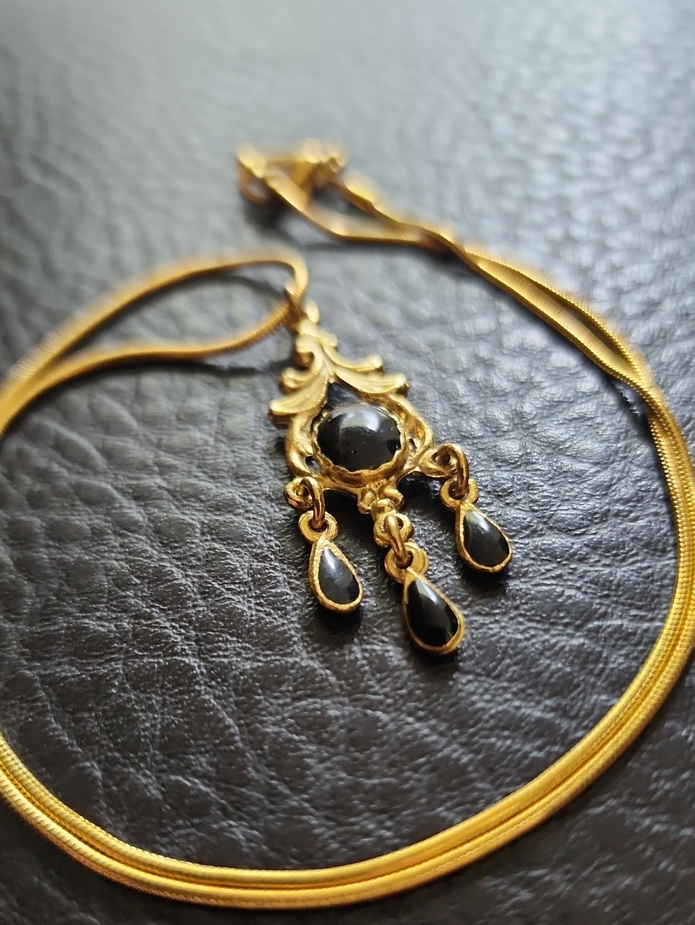 Gold-Tone Necklace with Black Gemstone Pendant